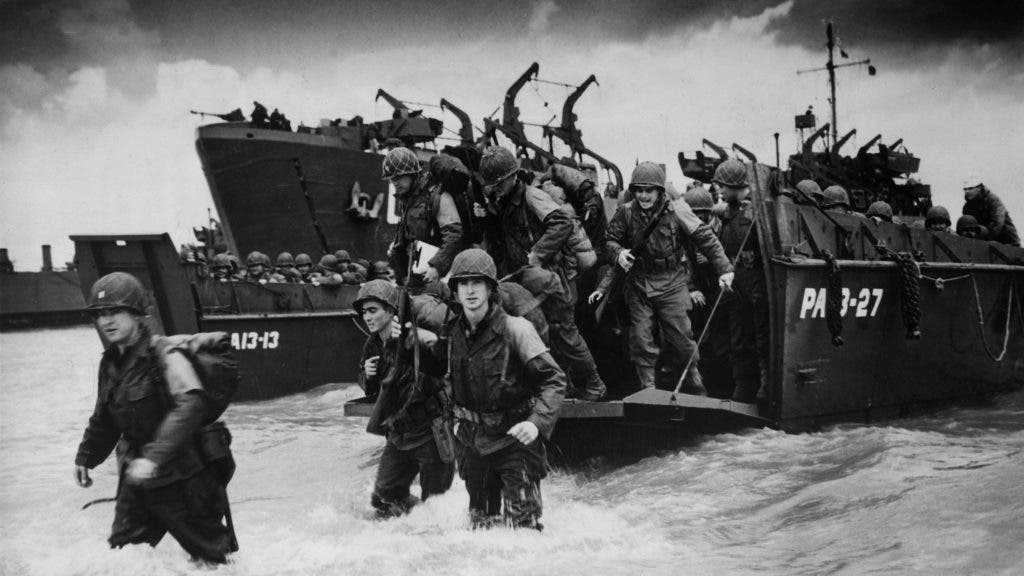 Reinforcements disembarking from a landing barge at Normandy during the Allied Invasion of France on D-Day.